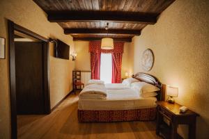 Postel nebo postele na pokoji v ubytování Hotel Jumeaux