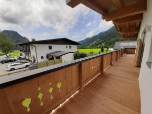 a balcony with a view of the mountains at Ferienhaus Kaiserblick - FEWO2 in Walchsee