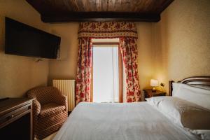 Postel nebo postele na pokoji v ubytování Hotel Jumeaux