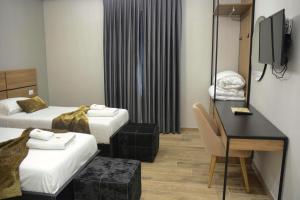 Katil atau katil-katil dalam bilik di HOTEL BRAXTON