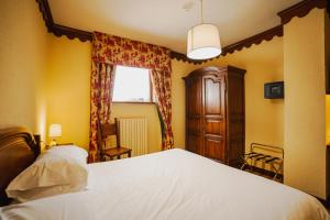Postel nebo postele na pokoji v ubytování Hotel Jumeaux