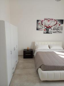 Posteľ alebo postele v izbe v ubytovaní Villa Di Giulio Suite