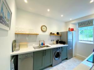 A kitchen or kitchenette at Tramontane Apartment at Hesketh Crescent