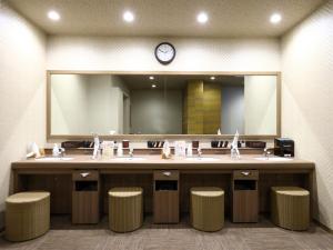 a bathroom with two sinks and a large mirror at Dormy Inn Express Fujisan Gotemba in Gotemba