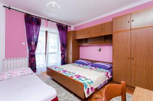 Postel nebo postele na pokoji v ubytování Apartments VESNA