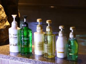 a group of four bottles sitting on a counter at Dormy Inn Express Fujisan Gotemba in Gotemba