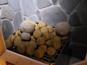 two teddy bears sitting in a basket of cookies at Dormy Inn Express Fujisan Gotemba in Gotemba