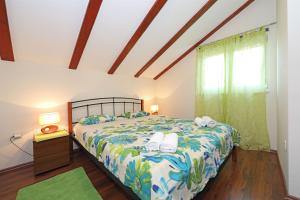 Postel nebo postele na pokoji v ubytování Apartments Josip