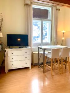 Televízia a/alebo spoločenská miestnosť v ubytovaní Executive Apartement Gastein