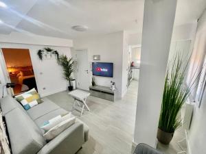 a living room with a couch and a tv at CASA SIMÓN in Albarracín