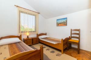 Postel nebo postele na pokoji v ubytování Apartment Krekovic