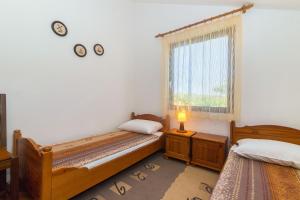 Postel nebo postele na pokoji v ubytování Apartment Krekovic