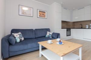 Η κουζίνα ή μικρή κουζίνα στο Little Laguna Apartments SPA & Gym by Noclegi Renters +46 φωτογραφίες