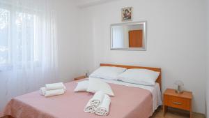 Postel nebo postele na pokoji v ubytování Apartments Tamaris
