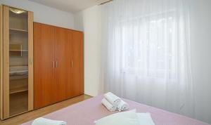 Postel nebo postele na pokoji v ubytování Apartments Tamaris