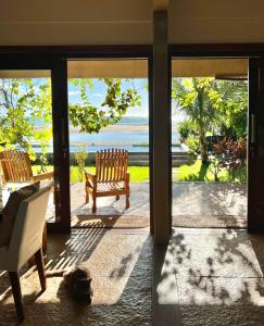 a living room with a view of the ocean at Casa Canoa Camocim in Camocim
