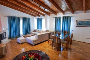 a living room with a couch and a table at Royal 1967 in Himare +167 photos