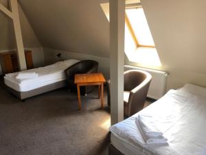 Postel nebo postele na pokoji v ubytování Hotel Krystyna