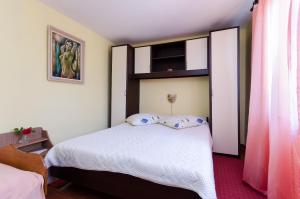 Posteľ alebo postele v izbe v ubytovaní Apartments Tugomila