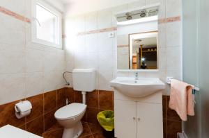 Kúpeľňa v ubytovaní Apartments Tugomila