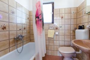 Kúpeľňa v ubytovaní Apartments Tugomila + 25 fotografií