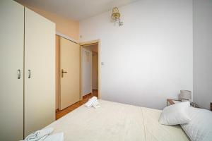 Postel nebo postele na pokoji v ubytování Apartments Zinfandel Vodice