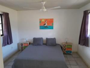 Postel nebo postele na pokoji v ubytování Kas di Ala apartments