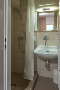 Koupelna v ubytování Hotel Garni