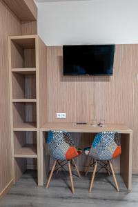 TV a/nebo společenská místnost v ubytování Hotel Garni