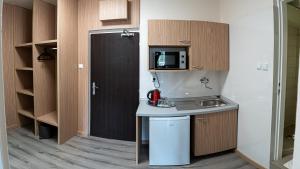 Kuchyň nebo kuchyňský kout v ubytování Hotel Garni