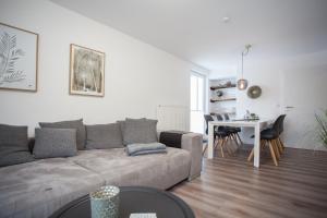 a living room with a couch and a table at WohnZauber in Winterberg