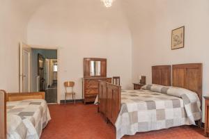 A bed or beds in a room at Rivierarent Casa Iolanda