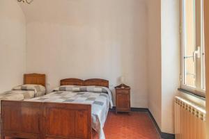 A bed or beds in a room at Rivierarent Casa Iolanda