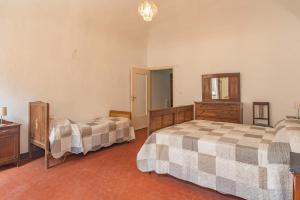 A bed or beds in a room at Rivierarent Casa Iolanda