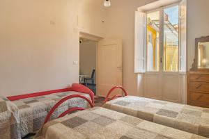 A bed or beds in a room at Rivierarent Casa Iolanda