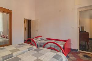 A bed or beds in a room at Rivierarent Casa Iolanda