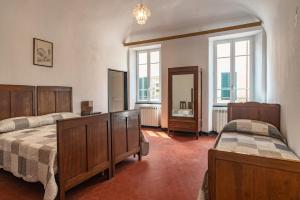 A bed or beds in a room at Rivierarent Casa Iolanda