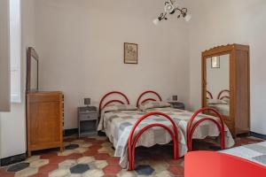 A bed or beds in a room at Rivierarent Casa Iolanda