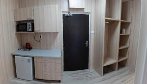 Kuchyň nebo kuchyňský kout v ubytování Hotel Garni