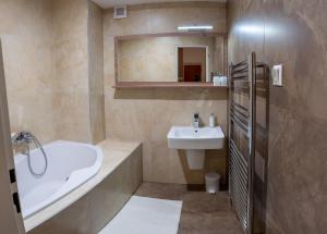 Koupelna v ubytování Hotel Garni