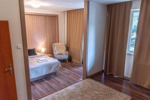 Postel nebo postele na pokoji v ubytování Hotel Garni