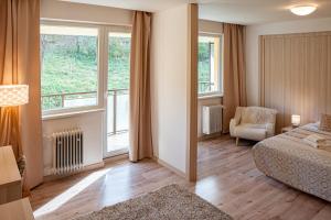 Postel nebo postele na pokoji v ubytování Hotel Garni