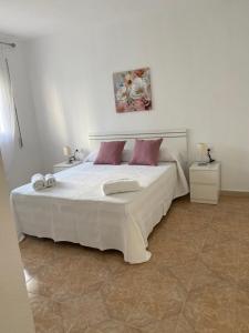 Postel nebo postele na pokoji v ubytování La Casa de Manolo