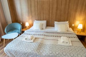 Postel nebo postele na pokoji v ubytování Hotel Garni