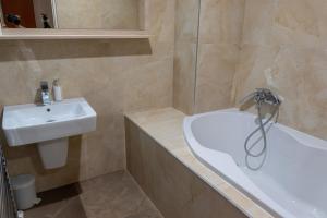 Koupelna v ubytování Hotel Garni