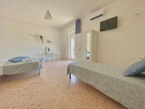 Postel nebo postele na pokoji v ubytování Guest House Service - Modugno