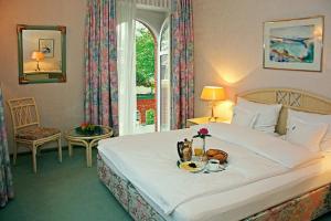 Postel nebo postele na pokoji v ubytování Hotel Residenz Joop
