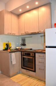 Kuchyň nebo kuchyňský kout v ubytování Homeyfeel Stay Sea 1 - Modern studio next to the sea!