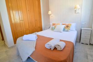 Posteľ alebo postele v izbe v ubytovaní LetMalaga Huelin beach