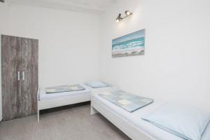 Postel nebo postele na pokoji v ubytování Apartments Mira